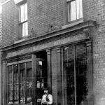 swinefleet-man-outside-butchers